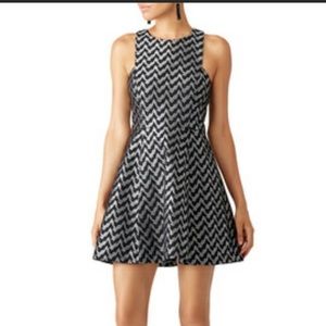 Likely silver and black mini dress